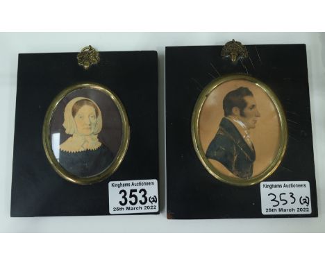 Two George III oval portrait miniatures, gentleman in profile and lady in a bonnet, watercolour, in black lacquer frames, lar