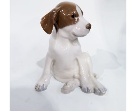 A Royal Copenhagen figure of a seated hound puppy, model 1453, painted and printed marks, seconds