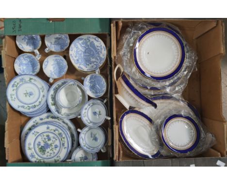 A Royal Worcester bone china blue and white tea service, dragon pattern, together with a Regency pattern dinner service (2 tr