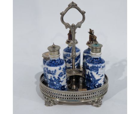 A Victorian Royal Worcester and silver plated cruet and stand, transfer printed blue and white decorated bottles on reticulat