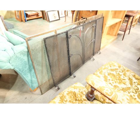 A triple brass and painted black firescreen (2)
