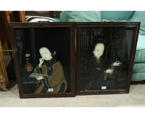 A pair of Chinese reverse portrait paintings on glass, one depicting a woman reading a scroll, the other a woman playing a ko