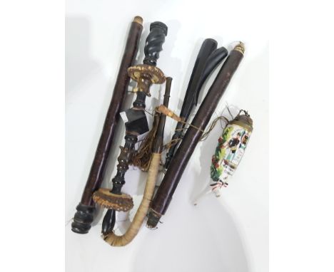 A 19th century hookah ceramic mouthpiece, decorated with German military insignia, laurel leaves and pickelhaube lid, togethe