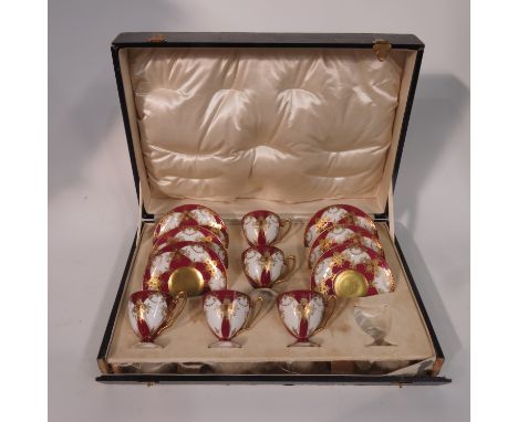 A Royal Worcester gilt jewelled part coffee set, including five cups an six saucers, cased