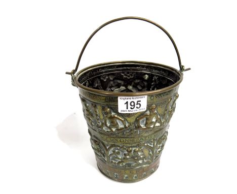 A 19th century historical revival brass bucket, Romanesque style, embossed with bands of winged figures above hunting scene w