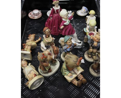 A collection of Hummel figures, to include girl and baby carriage, girl reading, carol singer etc, together with Four Royal W