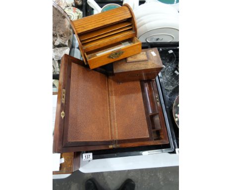 A Victorian rosewood brass bound writing slope, a William IV rosewood sarcophagus tea caddy and an oak tambour roll top stati