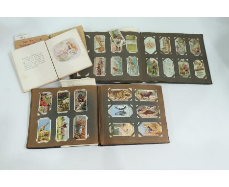 Two albums of cigarette cards to include De Resze, Cavander's Limited, Army Club Cigarettes - River Valleys, together with th