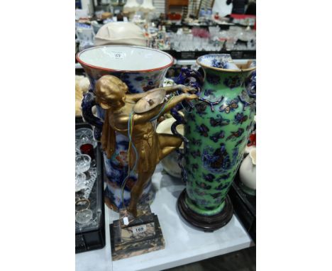 An Art Deco figural lamp base on marble plinth, a resin bust of a woman, a Staffordshire twin handled floor vase and two cast