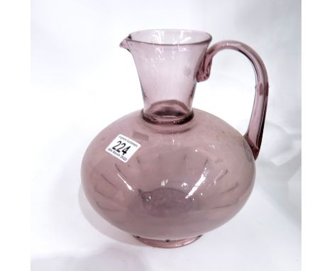 A pale amethyst art glass water jug, 24cm high