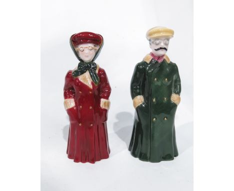 A pair of Royal Worcester Limited Edition candle snuffers 'The Motorists', circa 2000, modelled as a male and female in vinta