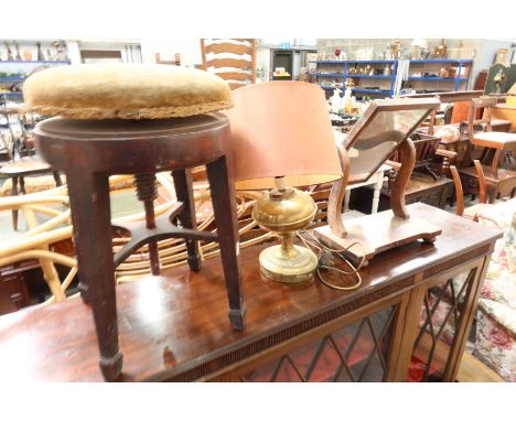 A George III mahogany height adjustable piano stool, a Victorian toilet mirror, a brass table lamp and a George III demi-lune