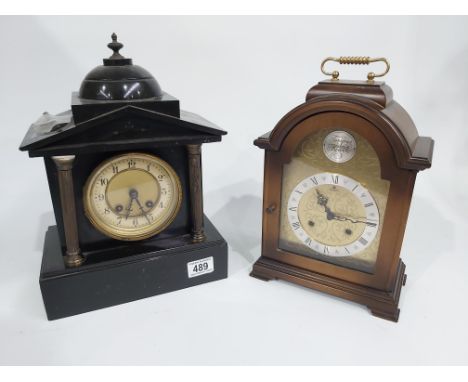 A Victorian black marble mantle clock, together with a modern German bracket clock.  (2)