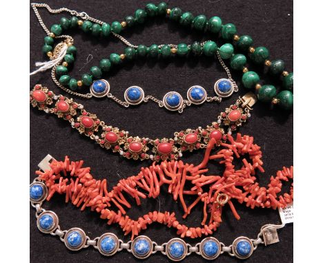 A collection of bead necklaces and bracelets including coral, lapis lazuli, malachite and jade type beads