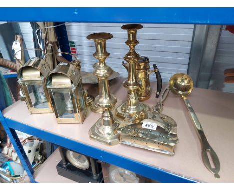 A collection of brassware including two pairs of candlesticks, skimmer, ladle, 2 glazed lanterns etc (9)