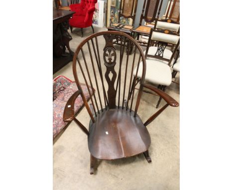 An Ercol Fleur de Lis rocking chair