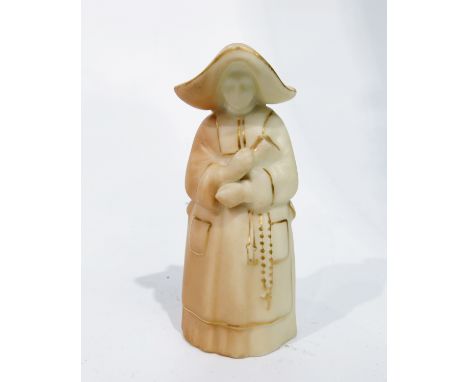 A Royal Worcester blush ivory candle snuffer, circa 1919, in the form of a nun, puce mark