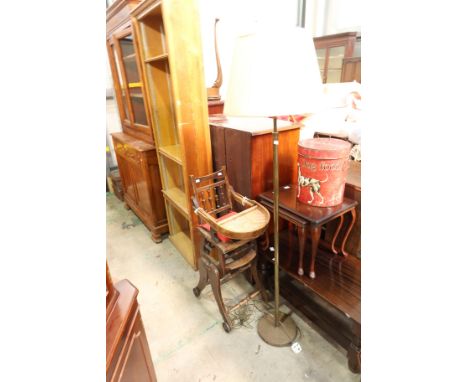 A Victorian child's highchair, and a brass floor standing library lamp (2)