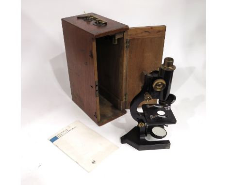 A 19th century brass and lacquered Beck microscope, with lens, in mahogany case with brass handle