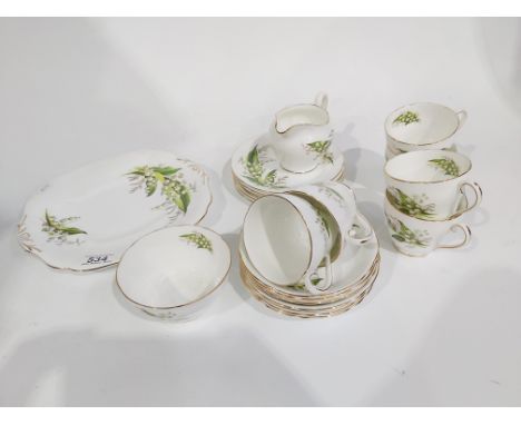 An Adderley bone china tea set, 'Lily of the Valley" pattern on white ground with gilt edges, including six cups and saucers,