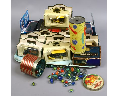 A tray of boxed die cast model cars and vintage toys including Corgi 007 vehicles, days gone and a tin of polychrome marbles.