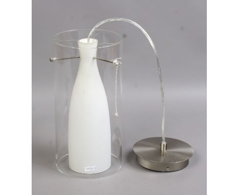 A brushed chrome pendant lamp with clear glass shade and internal milchglas bottle shade.