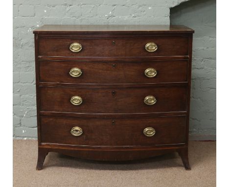 A George IV mahogany bowfront chest of four graduated drawers raised on splay bracket supports.