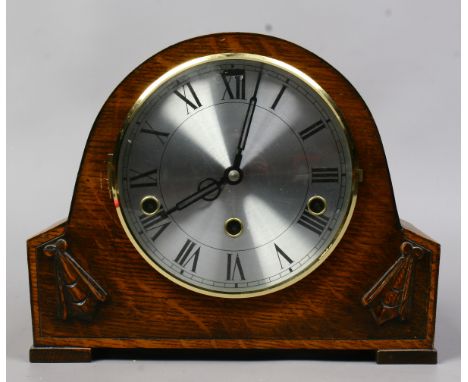 A 1930s oak cased mantel clock Westminster chiming.
