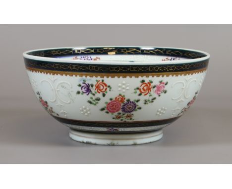 A C19th Sampson bowl after a Chinese armorial original with enamelled crest, scattered sprigs and bianco sopra bianco line wo