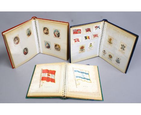 Three albums of silk cigarette cards to include famous people, army regiment crest, flags of countries etc.