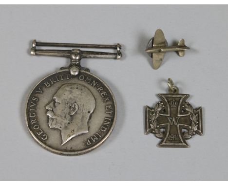 A World War I British victory medal 3988 Pte. J. W. Lowcock. S. LAN. R along with a miniature German iron cross medal and a s