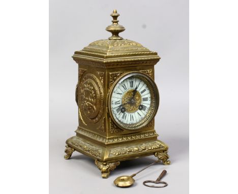 An early C19th eight day brass cased mantel clock having an enamel dial with pierced gilded decoration to the centre and Roma