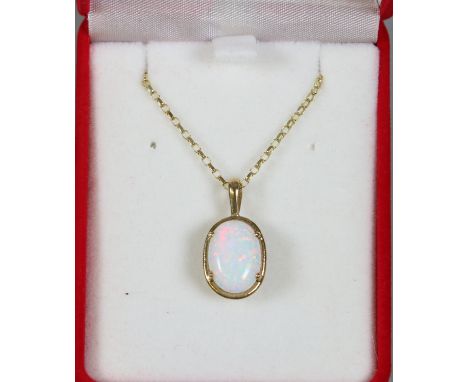 A 9ct gold pendant on chain set with an opal.