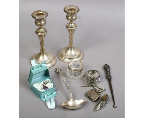 A continental silver toddy ladle by Berthold Muller, a pair of silver candlesticks assayed Chester 1911, a silver vesta case,