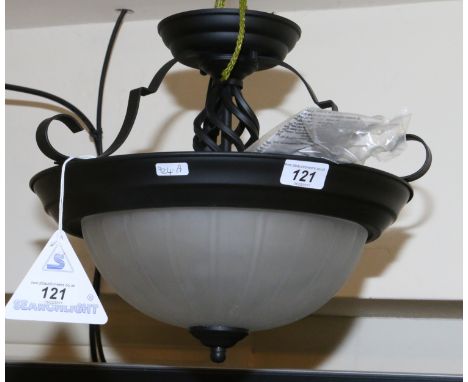A black wrought iron work reverse dome ceiling light with milchglas shade.