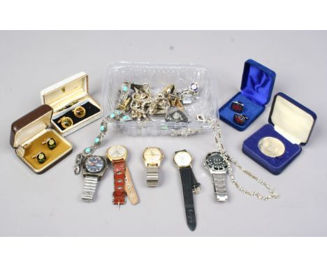 A box of vintage costume jewellery and assorted wristwatches including manual examples.