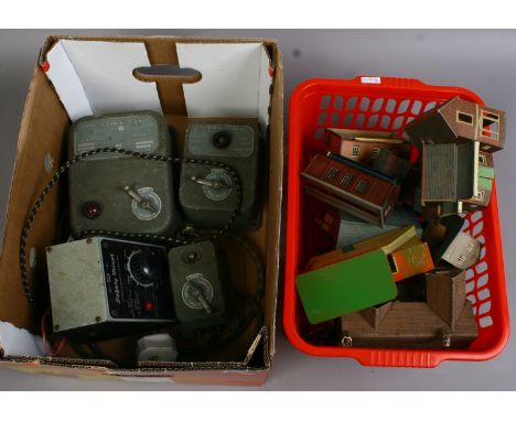 Two boxes of vintage railway power controls and model buildings including Hornby-Bublo etc.