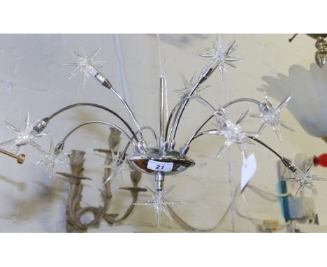 A chrome halogen star decorative ceiling light with glass star shaped shades.