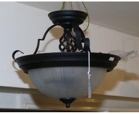 A new and unused black wrought iron work style two branch ceiling light with ribbed milchglas shade.