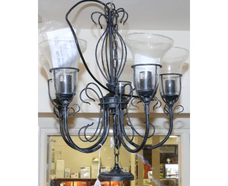 A wirework five branch ceiling light with clear glass shades.