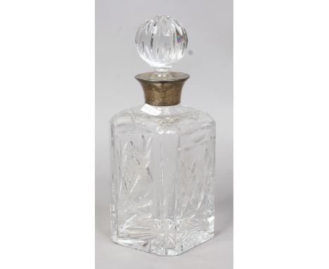 A cut glass decanter etched with a bird of prey and with silver collar assayed Sheffield.