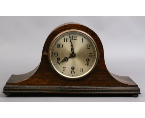 An oak cased 1930s Westminster chime dome top mantle clock.