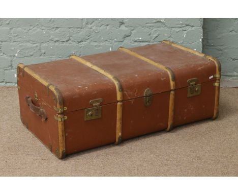 A vintage wood bound steamer trunk.