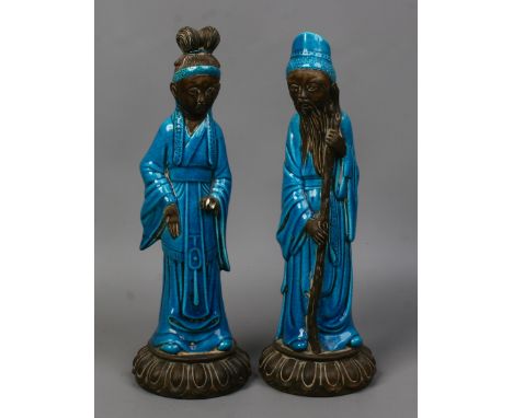 Two Asian ceramic figures of sages decorated with turquoise glaze.