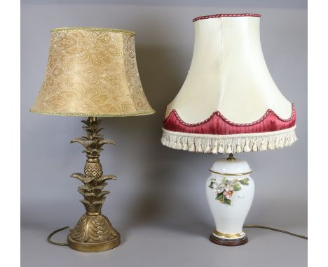 Two table lamps including a ceramic lamp base and shade decorated with flowers along with another raised on a pineapple base 