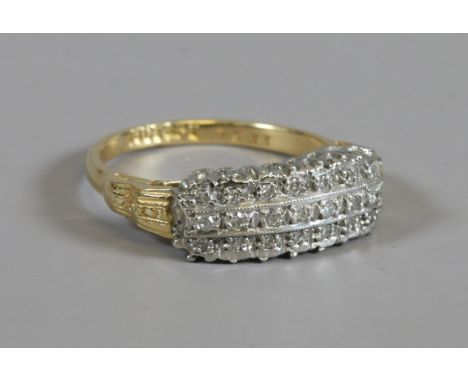 An Art Deco 18ct gold and platinum three row diamond ring, size K.