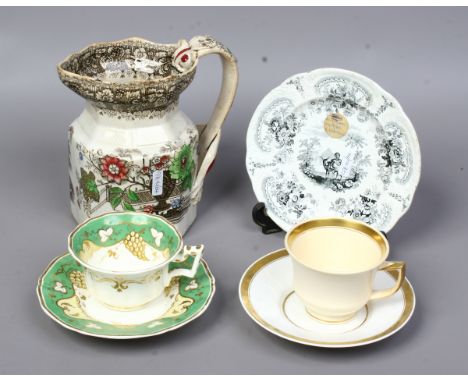 Two Rockingham cups and saucers, Brameld Don Quixote pattern small plate and a Twigg pottery hydra jug.