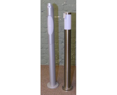 A stainless steel post light along with a brushed alluminium post light.
