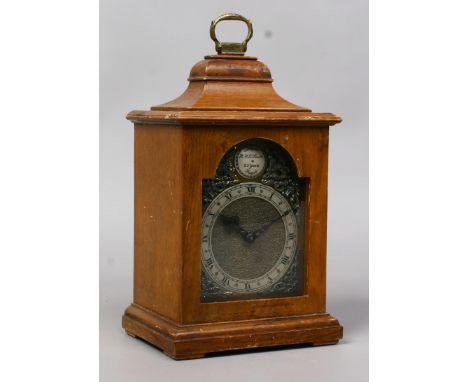 A mahogany cased bracket clock with gilt spandrels and Roman numerals.