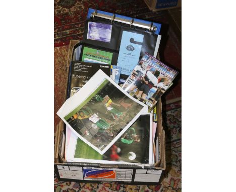 A box of local rugby and football programmes along with an album of Rotherham United F.C ticket stubs.